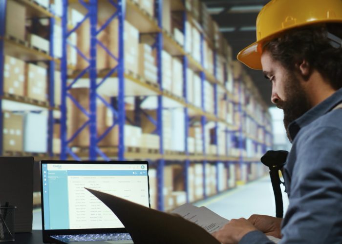 Export supervisor drafting billing for product logistics, managing shipping and delivery requirements. Factory operator reviewing dispatch reports for order submission and stock control.