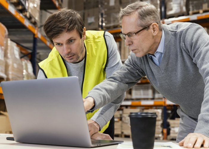 men-warehouse-working-laptop